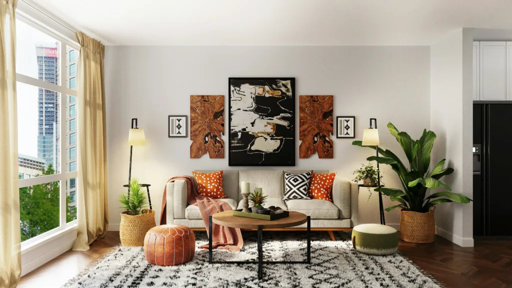 Stylish living room with a beige sofa, colorful cushions, abstract art on the walls, a round wooden coffee table, and lush plants. Bright and cozy ambiance.